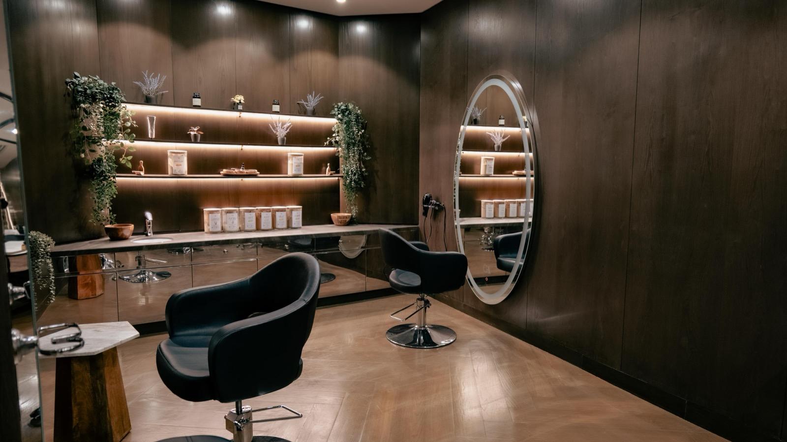 Spacious salon floor with Arabian-inspired design and modern equipment